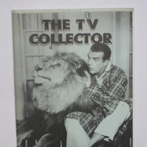 May include: A black and white photo of a man in a plaid shirt holding a lion. The magazine cover reads "The TV Collector" with the volume and issue number "Vol. 2 No. 59" and the date "Mar.-Apr. '92".