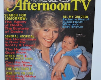 Op de afbeelding: Een tijdschriftcover met een vrouw die een baby vasthoudt. Het tijdschrift heet "Afternoon TV" en bevat artikelen over populaire soapseries, waaronder "General Hospital", "The Doctors", "One Life to Live", "Ryan's Hope" en "As the World Turns".