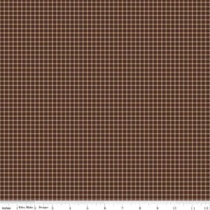May include: Brown and tan plaid fabric with a grid pattern. The fabric is measured in inches, with a ruler along the bottom edge. The fabric is from Riley Blake Designs.