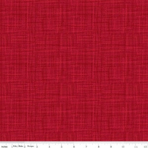 May include: Red fabric with a textured woven pattern. The fabric has a subtle sheen and a slightly rough texture.