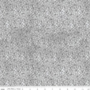 May include: A white fabric with a repeating pattern of small gray flowers and leaves. The fabric is textured and has a subtle sheen.