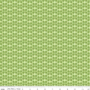 May include: A green and white fabric with a repeating pattern of small green four-leaf clover designs.