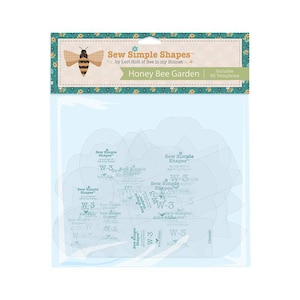 May include: A clear plastic package containing sewing templates. The package has a decorative header with a bee illustration and the text "Sew Simple Shapes Honey Bee Garden." The templates are labeled with text and shapes.