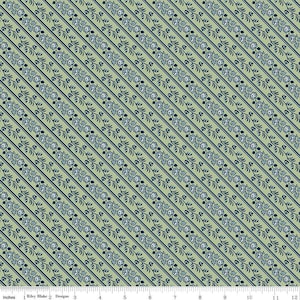 May include: A green fabric with a repeating pattern of blue floral sprigs on diagonal lines. The fabric is measured in inches.