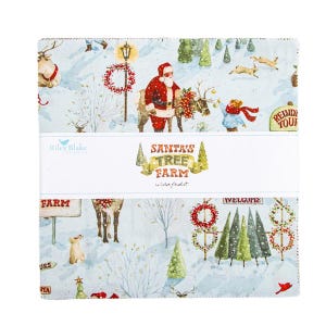 May include: A stack of Christmas-themed fabric squares featuring Santa Claus, reindeer, and winter scenes. The fabric has a light blue background with illustrations of trees, wreaths, and the text "Santa's Tree Farm".