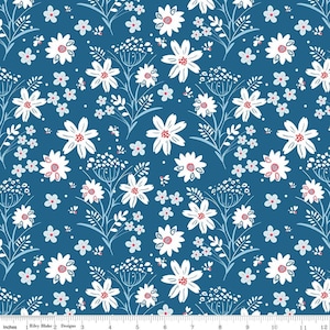 May include: A fabric with a repeating floral pattern. White daisy-like flowers with red centers and small blue flowers are scattered across a dark blue background. The design includes thin, light blue stems and leaves, creating a botanical theme.