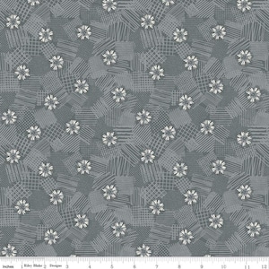 May include: A gray and white fabric with a repeating pattern of stylized flowers. The fabric has a subtle texture and a geometric design.