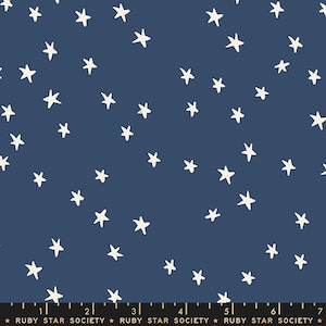 May include: A navy blue fabric with a white star pattern. The stars are of varying sizes and are scattered randomly across the fabric.