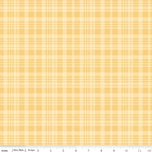 May include: A fabric with a yellow and light yellow plaid pattern. The fabric has a grid-like design with intersecting vertical and horizontal lines. The image includes a ruler at the bottom with the word "Inches" and the text "Riley Blake Designs".