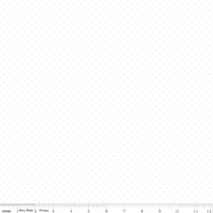 May include: White fabric with a subtle, repeating pattern of small, light gray dots. The dots are evenly spaced across the surface. The fabric is measured in inches along the bottom edge, with the Riley Blake Designs logo visible.