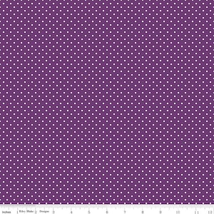May include: Purple fabric with a white polka dot pattern. The fabric is 12 inches wide.