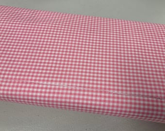 May include: Pink and white gingham fabric with a small check pattern.