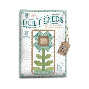 May include: A quilt pattern booklet with a green and brown flower design. The title is "Prairie Quilt Seeds" and the text "Just Add Stitches" is on the left side of the page. The text "100% Cute" is on a brown tag.