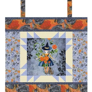 May include: A tote bag featuring a central square panel with a witch illustration, orange roses, and a cat on a gray background. The panel is framed by light blue star points and borders of orange and gray floral fabric with a top handle.