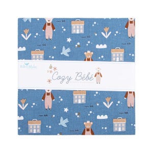 May include: A stack of fabric squares with a blue background featuring repeating patterns of houses, bears, flowers, and birds. The fabric has the text "Cozy Bébé" and "Riley Blake" printed on it.