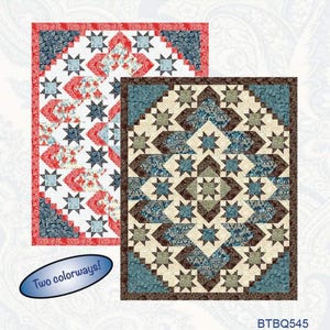 May include: Two quilt patterns are displayed, showcasing star and geometric designs. One quilt features red, white, and blue floral patterns, while the other has a brown, blue, and beige color scheme. The text "Decorator Jewel" is at the top.