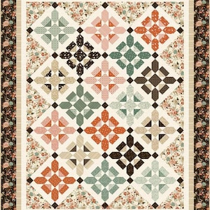 May include: A patchwork quilt with a floral border and a cream-colored background. The quilt features a repeating pattern of colorful, geometric blocks in shades of orange, pink, green, brown, and cream. The border is a dark brown with a floral pattern.