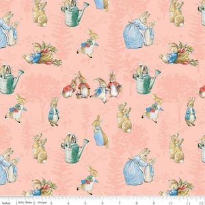 May include: A repeating pattern featuring illustrations of rabbits in various poses, watering cans, and a forest scene. The rabbits are dressed in blue and red jackets and dresses, set against a light pink background. The fabric measures 12 inches across.