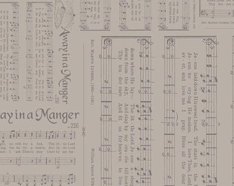May include: A tan fabric featuring a repeating pattern of musical scores and lyrics. The text "Away in a Manger" is prominently displayed, along with other song lyrics and musical notations. The fabric is suitable for quilting or crafting.