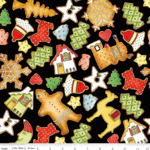 May include: A black fabric featuring a repeating pattern of colorful holiday-themed cookies, including gingerbread people, houses, stars, snowflakes, trees, and animals, with a white ruler at the bottom showing 12 inches of length.