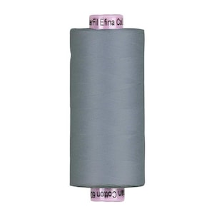 May include: A spool of solid medium gray sewing thread. The spool features light pink end caps with black text printed on them. The top cap reads WonderFil Efina Cotton, and the bottom cap reads Cotton 60, indicating the thread type and weight.