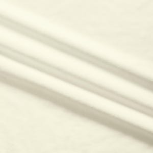 May include: Cream-colored fabric with diagonal folds and shadows. The fabric has a soft, textured appearance, with subtle variations in tone. The folds create a sense of depth and movement across the surface.