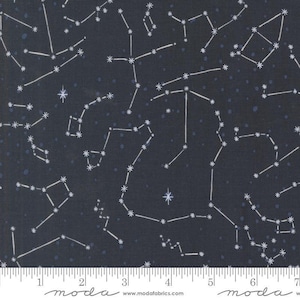 May include: Dark navy fabric with a constellation pattern. White lines connect star-shaped dots, forming constellations against a dark background. Small blue dots are scattered throughout. The fabric has a ruler along the bottom with the word "moda" and website address.