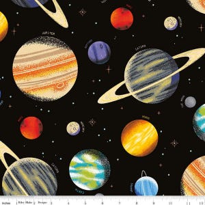 May include: A black fabric featuring a colorful illustration of planets and stars. The planets include Jupiter, Saturn, Earth, Venus, Mars, Mercury, Neptune, and Uranus. The fabric has a space or astronomy theme.