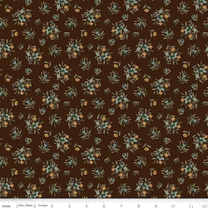 May include: A dark brown fabric featuring a repeating pattern of small floral bouquets in muted teal, light blue, and yellow, accented with green leaves. A white ruler at the bottom shows a scale of 12 inches for the fabric design.