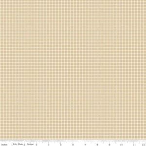 May include: Tan and cream plaid fabric with a grid pattern. The fabric is marked with a ruler along the bottom edge, showing measurements in inches. The fabric is from Riley Blake Designs.