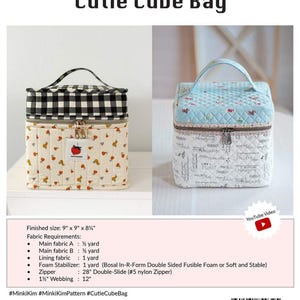 May include: Two "Cutie Cube Bags" are displayed. One features a black and white checkered top and a cream-colored body with a strawberry pattern. The other has a light blue quilted top and a white body with script. The finished size is 9" x 9" x 8 3/4".