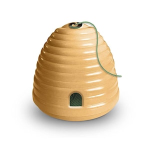 May include: A tan-colored, beehive-shaped decorative item with a green string attached. The beehive has a small, arched opening filled with green material. The design features horizontal ridges, giving it a textured appearance.
