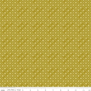May include: Mustard-colored fabric with a repeating pattern of white diamond shapes and dotted lines. The fabric is measured in inches, with the Riley Blake Designs logo visible at the bottom.
