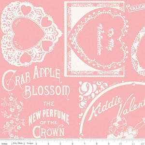 May include: Pink fabric with a white design featuring a heart-shaped frame with the text "To My Valentine", a floral design with the text "Crab Apple Blossom", and the text "The New Perfume of the Crown".
