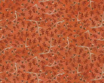 May include: A seamless fabric pattern featuring a repeating design of brown oak leaves and acorns on a burnt orange background.