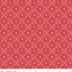 May include: Red fabric with a repeating pattern of white floral designs. The fabric is 12 inches wide and has a ruler marked in inches along the bottom.