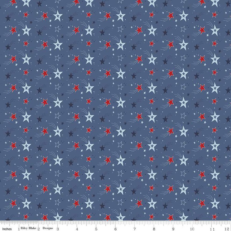 Image of the Stars and Stripes Forever Shooting Stars Blue quilting cotton fabric by Lori Whitlock for Riley Blake Designs. Features stars on a blue background. Cute Little Fabric Shop