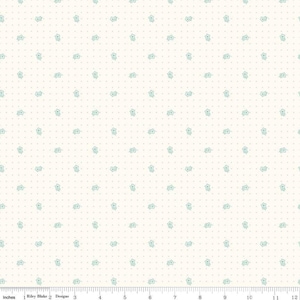 May include: White fabric with a repeating pattern of small, light blue flowers. The fabric is 12 inches wide.