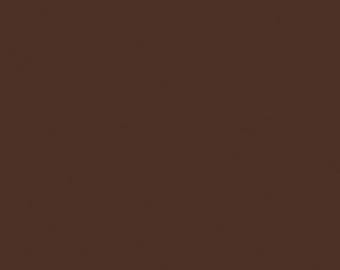 May include: Solid brown background with a textured appearance. The color is a rich, dark shade of brown, providing a neutral backdrop.