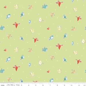 May include: A green fabric with a white polka dot pattern and a repeating design of colorful birds. The birds are in various shades of blue, yellow, red, and orange.