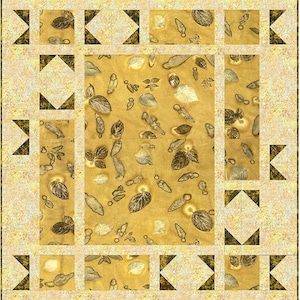 May include: A quilt with a beige background and a pattern of brown leaves. The quilt is framed with a border of black triangles and beige squares.