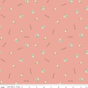 May include: A pink fabric with a repeating pattern of green leafy vegetables, small white turnips, and red radishes.