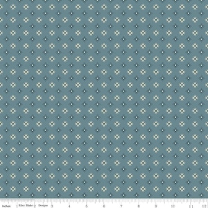 May include: A fabric with a repeating pattern of small, stylized starbursts in cream and navy blue on a muted teal background. The design is evenly spaced across the fabric, creating a consistent and visually appealing texture. The fabric is measured in inches.