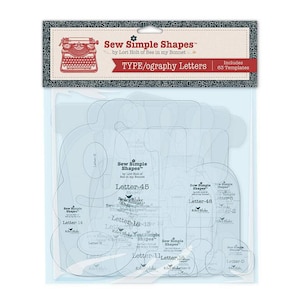 May include: A package of clear plastic sewing templates with various letter shapes. The package includes the text "Sew Simple Shapes" and "TYPE/ography Letters". The templates are designed by Lori Holt of Bee in my Bonnet.