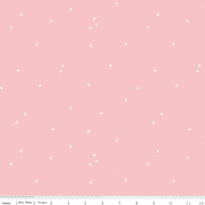 May include: A pink fabric with a white polka dot pattern. The dots are evenly spaced and are a light cream color.