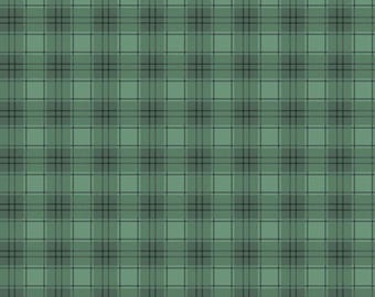 May include: A green plaid fabric featuring a repeating tartan pattern of intersecting dark green and light green lines. A white ruler at the bottom edge shows a scale of 12 inches, with the text Riley Blake Designs printed on the ruler.