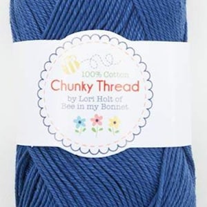 May include: A ball of blue 100% cotton yarn labeled "Chunky Thread by Lori Holt of Bee in my Bonnet."