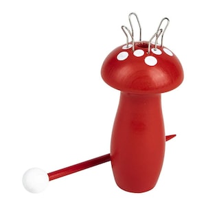 May include: Red wooden mushroom-shaped knitting loom with white polka dots and a white-tipped red knitting needle.