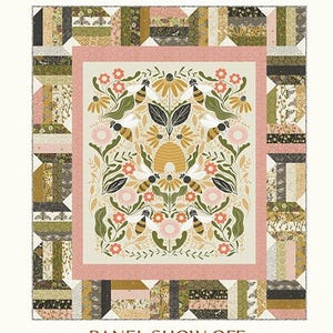 May include: A throw quilt with a floral and bee design, measuring 56.5 x 64.5 inches. The quilt features a central panel with bees, flowers, and a honeycomb, framed by a pink border and patchwork patterns. The text "PANEL SHOW OFF" is displayed.