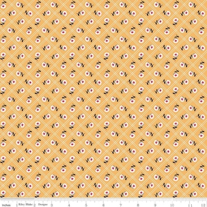 May include: A yellow fabric with a repeating pattern of white flowers with pink centers. The flowers are arranged in a diamond pattern on a yellow background.